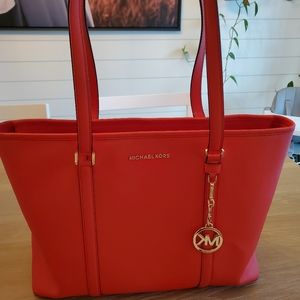 Red Michael Kors laptop bag